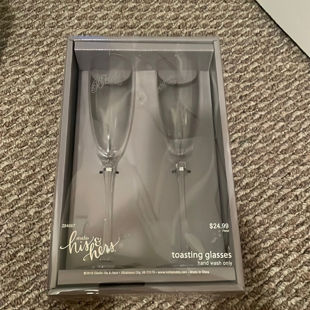 Bride and groom toasting glasses